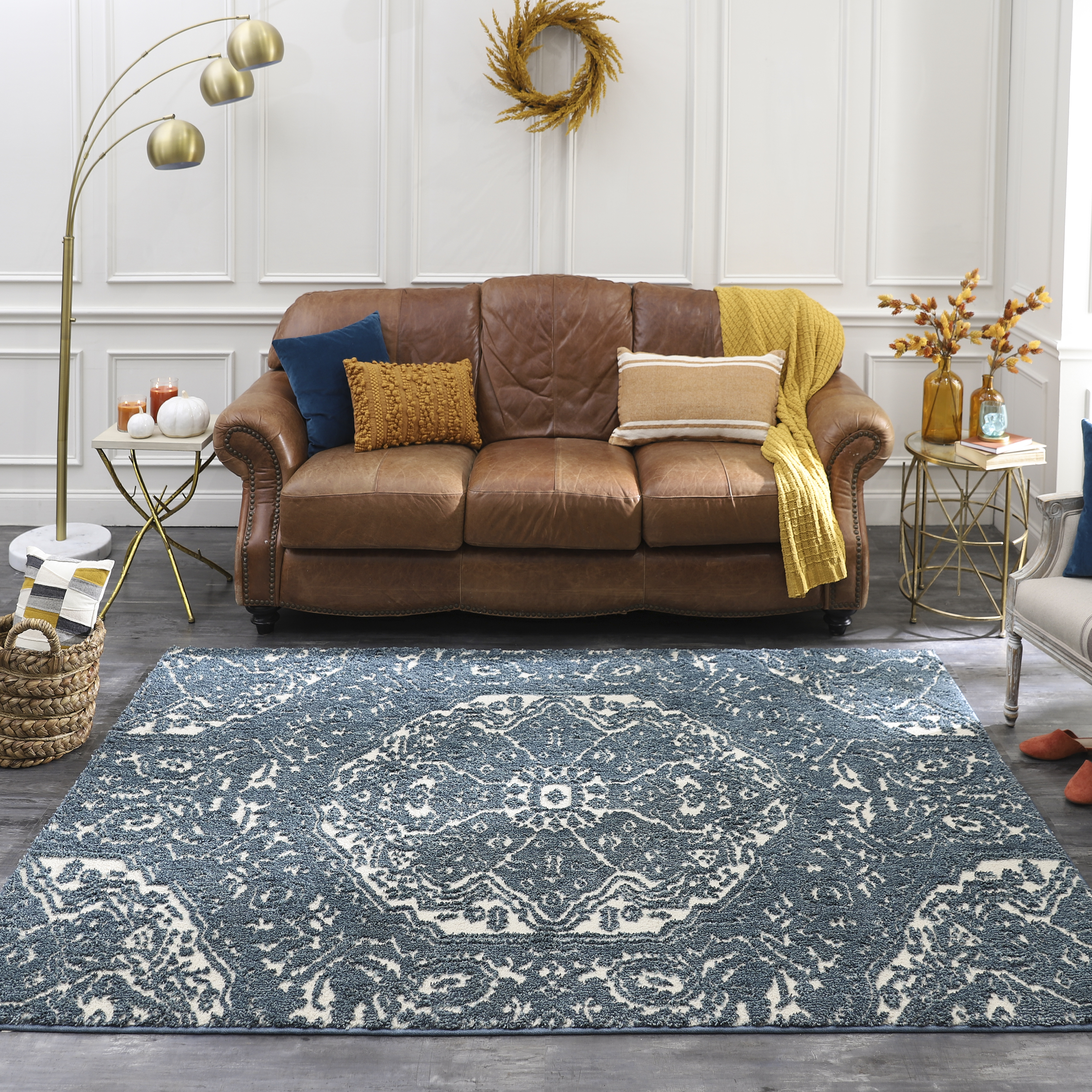 How Should Rugs Go Under The Couch?